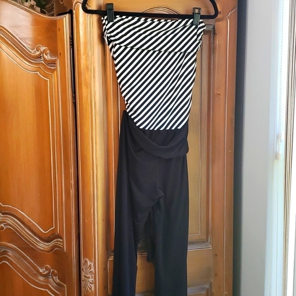 Haulter jumpsuits.‎ Black and white striped top. Black bottom Wide leg. By Lepis